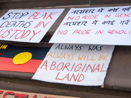 Invasion Day Rally | signs, stop black deaths in custody, no pride in genocide, always was always will be Aboriginal land, Aboriginal flag | Queensland Gallery of Modern Art